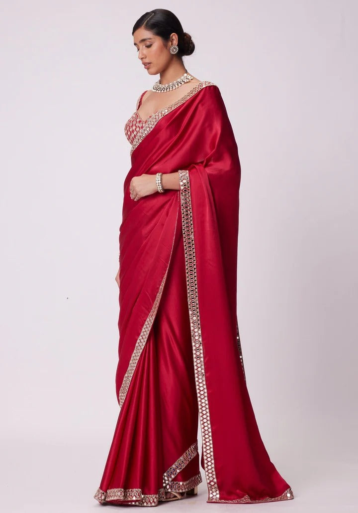 SAHELI STYLE PRSENTS Rangoli Silk saree features intricate real mirror work embroidery along the border Saree