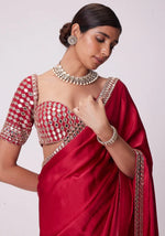 SAHELI STYLE PRSENTS Rangoli Silk saree features intricate real mirror work embroidery along the border Saree