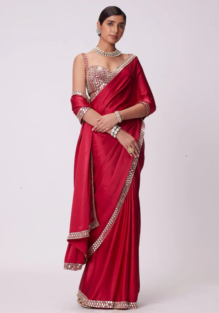 SAHELI STYLE PRSENTS Rangoli Silk saree features intricate real mirror work embroidery along the border Saree