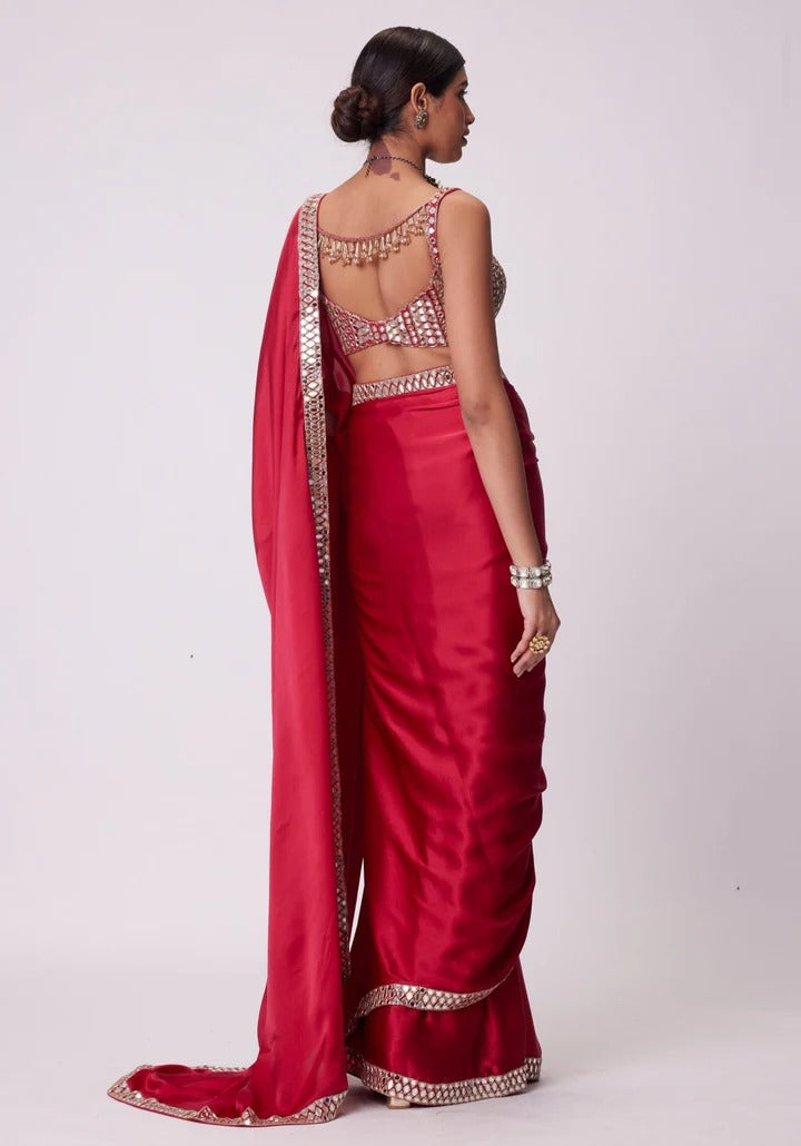 SAHELI STYLE PRSENTS Rangoli Silk saree features intricate real mirror work embroidery along the border Saree