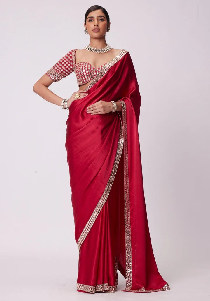 SAHELI STYLE PRSENTS Rangoli Silk saree features intricate real mirror work embroidery along the border Saree